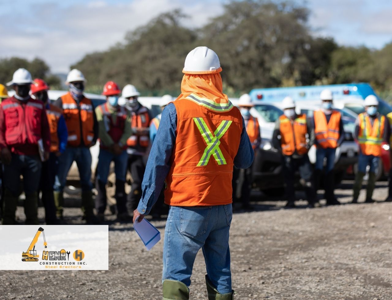 Team conducting a daily safety briefing before steel erection begins
