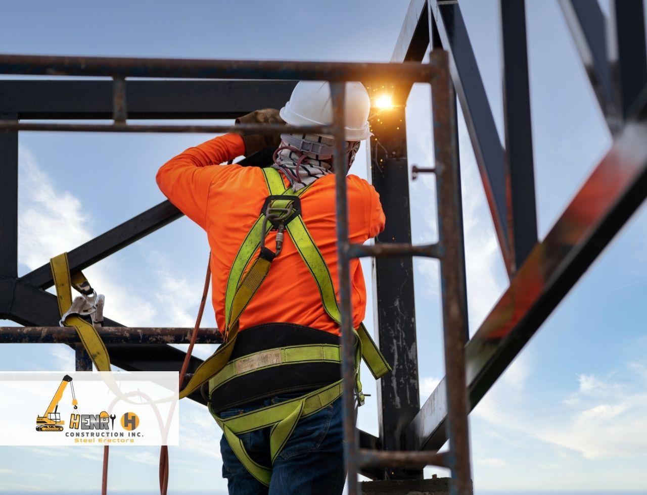 Steel erection team using safety gear to prevent accidents on elevated structure