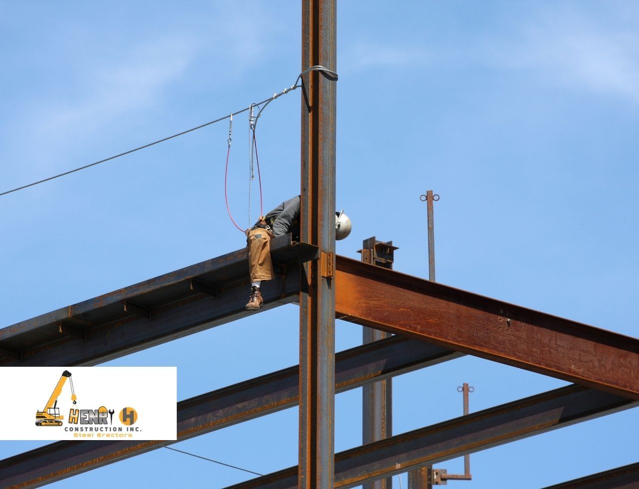 Ironworkers placing a steel beam on a commercial jobsite