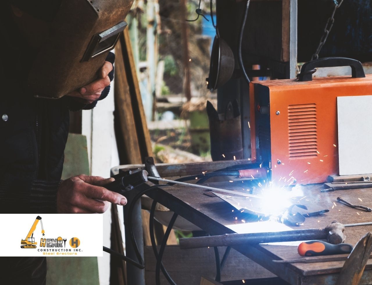 Welding machine and protective gear on steel frame site
